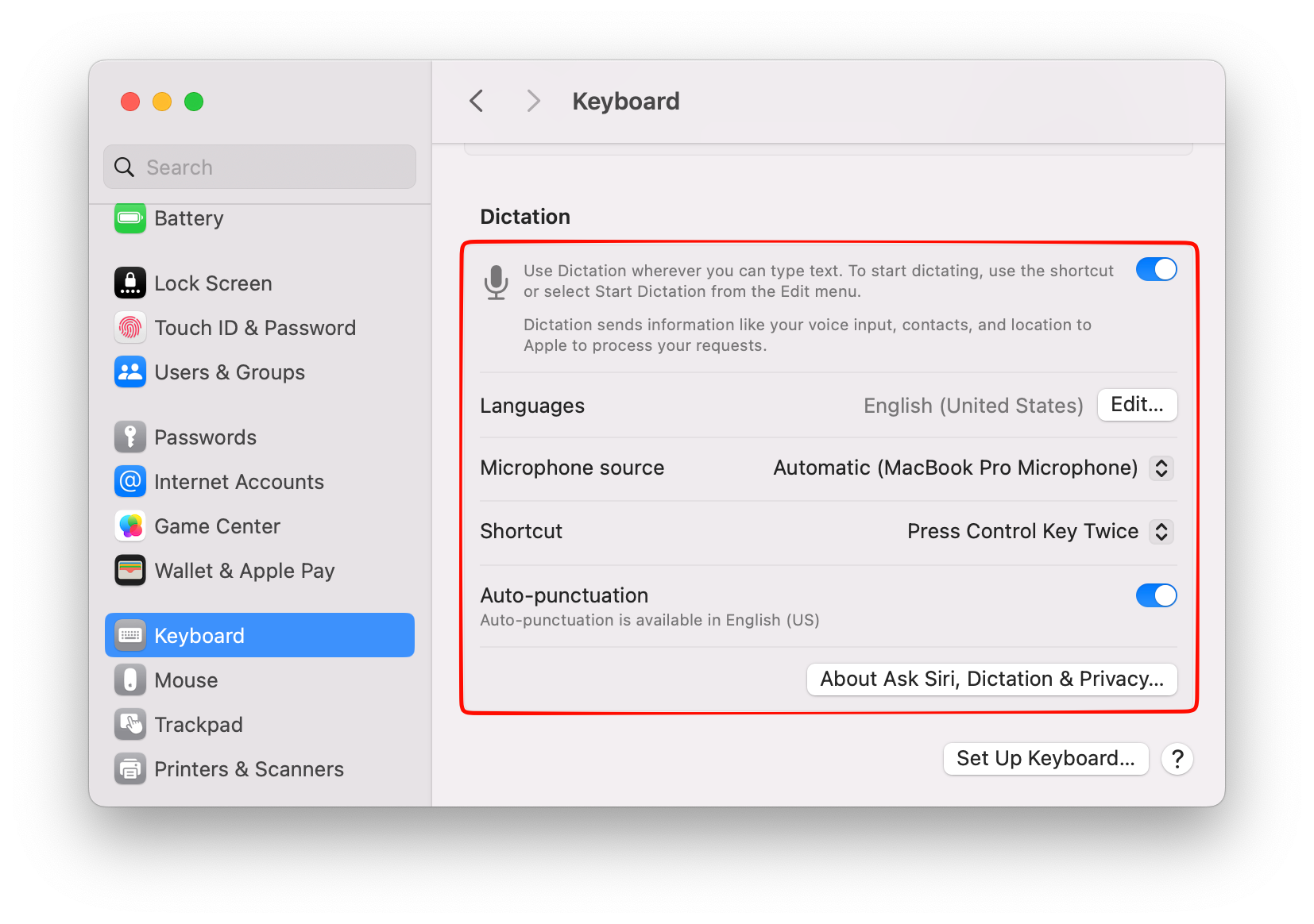 The Dictation panel in macOS Keyboard settings showing the privacy notice, language row, shortcut menu, microphone source, and auto-punctuation toggle